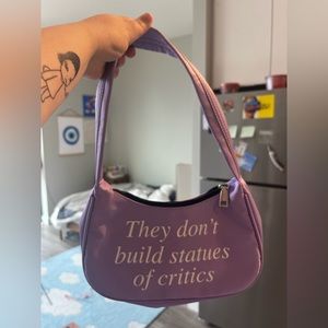 Praying ✝️ they dont build statues of critics bag!! NWOT!!!